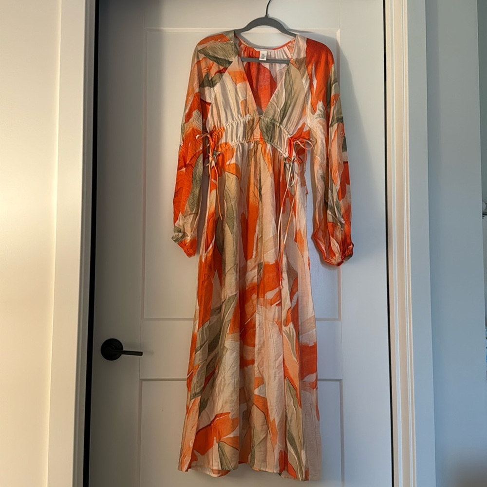 Women colorful flowy long dress with long sleeves.